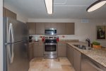 Fully equipped kitchen with microwave, dishwasher, and coffee maker 